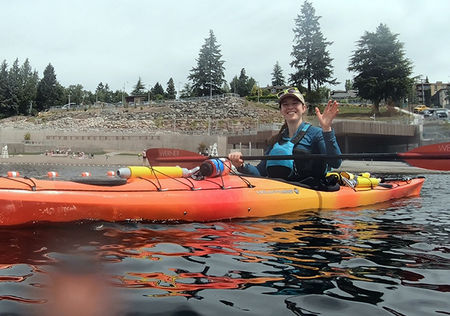 A woman kayaks in Meydenbauer Bay.