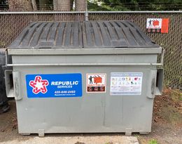 Dumpster with stickers