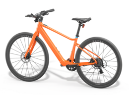 Orange bike frame with two wheels, foot pedals and a black handle bar