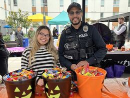 Image of Bellevue Police Officers at a trick-or-treat Halloween event in 2025.