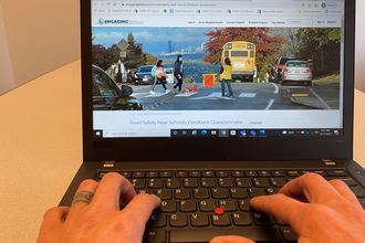 An image showing someone using a computer to visit EngagingBellevue.com to complete the Road Safety Assessment questionnaire.