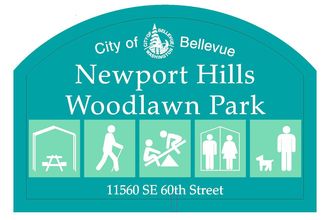 Teal Sign with City of Bellevue Logo and words "Newport Hills Woodlawn Park" underneath are icons for park amenities. From left to right: picnic shelter, hiking trails, playground, restroom, off-leash dog area