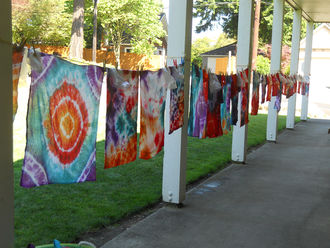 Image of tie dye tshirts on a clothing line
