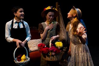 image of three young actors performing a play on stage