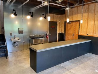 Inside view of the new Mercer Slough farmstand shows a long countertop and wash station