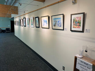 SBCC hallway with framed paintings