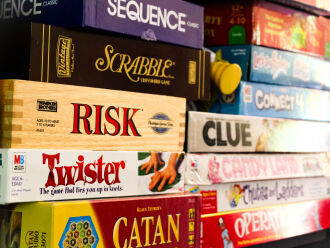 Image of table or board games stacked.