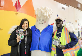 Bellevue conservation mascot Carbon Yeti poses with representatives of the winning schools on Dec. 12.