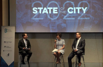 Mayor Lynne Robinson (center) speaks during the 2022 State of the City event, with Deputy Mayor Jared Nieuwenhuis (right).