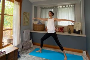 Pilates instructor leads virtual class from home.