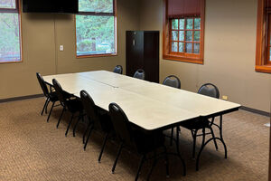 image of meeting room with table and 8 chairs
