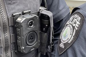 Body cams and police badge