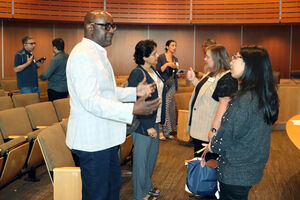 A group of people discussing about Innovative Partnerships.