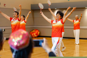 Activity Guide cover shows performers at Crossroads Community Center