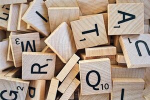 A pile of scrabble letter tiles.