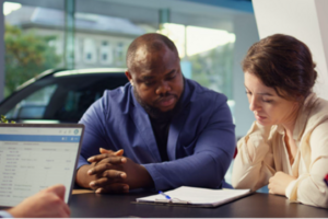 two people look at paperwork