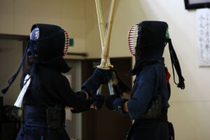 two people engaged in kendo sparring