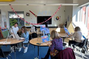A group of people in a painting class