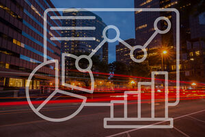 City photo at night with graphic representing charts and graphics over the photo