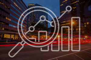 City photo at night with graph and magnifying lens illustration on top